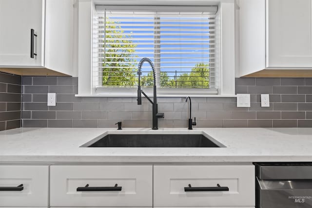 5990 W View Dr, Meridian, ID 83642 - kitchen with a sink, stainless steel dishwasher, white cabinetry, and light stone countertops