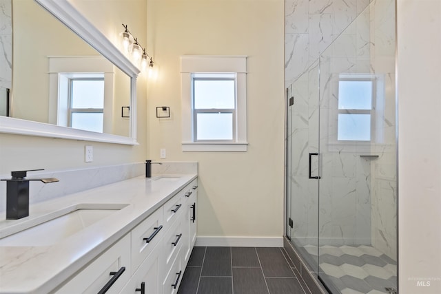 5990 W View Dr, Meridian, ID 83642 - bathroom featuring healthy amount of natural light, double vanity, a marble finish shower, and baseboards