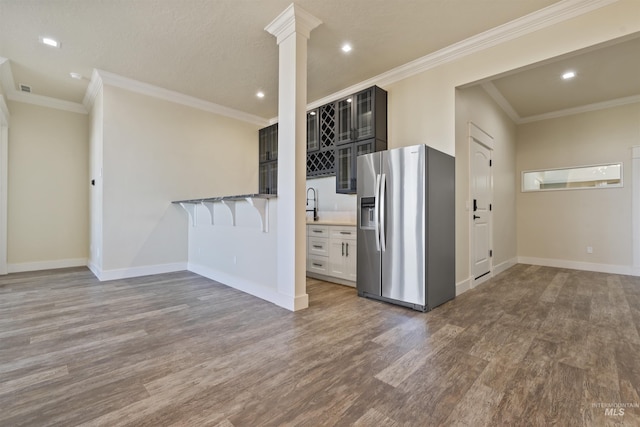 5990 W View Dr, Meridian, ID 83642 - kitchen featuring stainless steel fridge, dark wood-type flooring, baseboards, ornamental molding, and recessed lighting