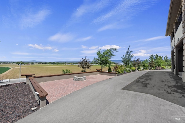 5990 W View Dr, Meridian, ID 83642 - view of patio / terrace featuring a fire pit and a mountain view