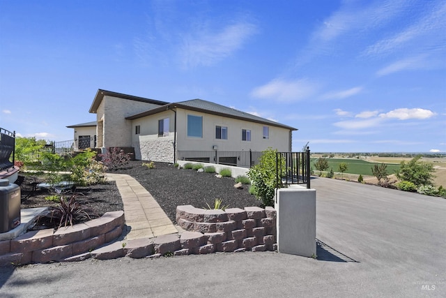 5990 W View Dr, Meridian, ID 83642 - rear view of house featuring stucco siding and stone siding