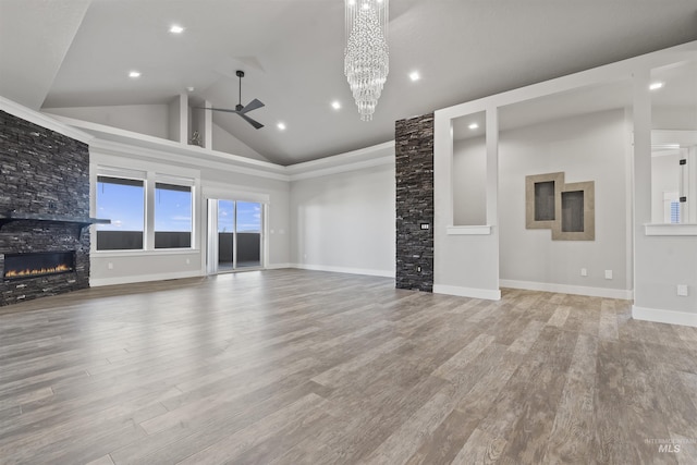 5990 W View Dr, Meridian, ID 83642 - unfurnished living room featuring ceiling fan, a fireplace, wood finished floors, recessed lighting, and high vaulted ceiling