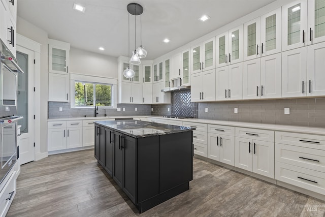 5990 W View Dr, Meridian, ID 83642 - kitchen featuring wood finished floors, a sink, white cabinets, and recessed lighting