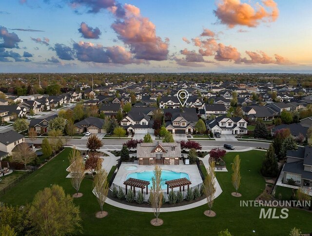 aerial view at dusk with a residential view