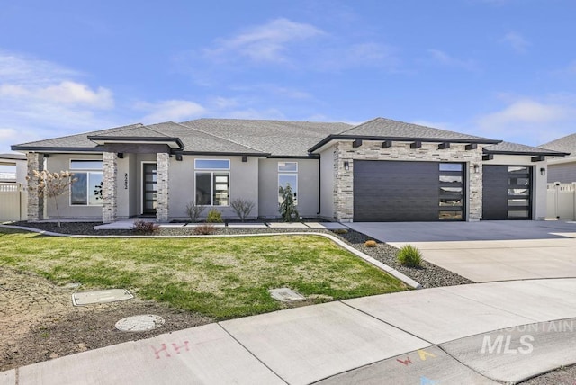 2252 Detweiler Pl, Twin Falls, ID 83301 - prairie-style house featuring stucco siding, stone siding, driveway, a front lawn, and a garage