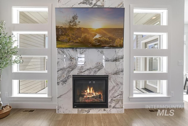 2252 Detweiler Pl, Twin Falls, ID 83301 - details with visible vents, a high end fireplace, and wood finished floors