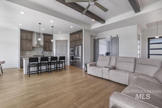 2252 Detweiler Pl, Twin Falls, ID 83301 - living room featuring light wood-style floors, beam ceiling, recessed lighting, and a ceiling fan