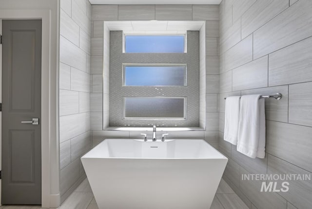 2252 Detweiler Pl, Twin Falls, ID 83301 - bathroom featuring a freestanding tub and tile walls