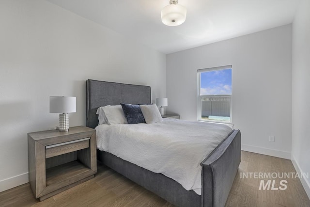 2252 Detweiler Pl, Twin Falls, ID 83301 - bedroom featuring baseboards and wood finished floors