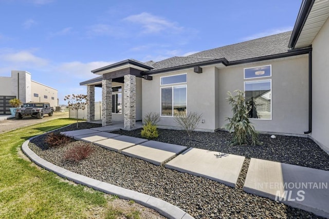 2252 Detweiler Pl, Twin Falls, ID 83301 - view of front of house with stucco siding and a patio area