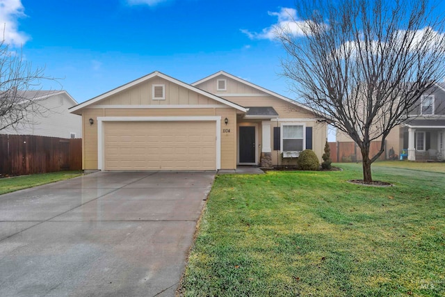 view of front of house featuring a garage and a front yard