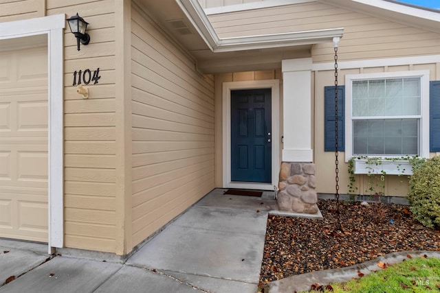 entrance to property featuring a garage