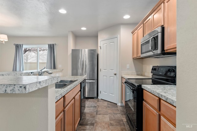 kitchen featuring sink and black appliances