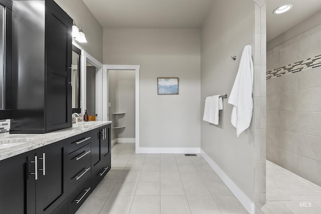 3924 E Forked Deer St, Boise, ID 83716 - bathroom with double vanity, walk in shower, tile patterned floors, and recessed lighting