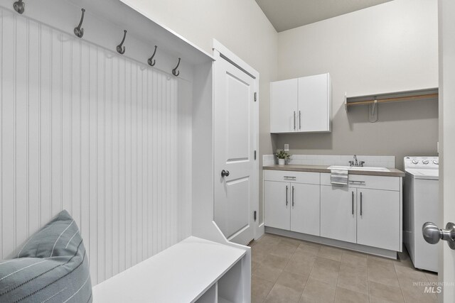 3924 E Forked Deer St, Boise, ID 83716 - mudroom with washer / dryer and light tile patterned floors