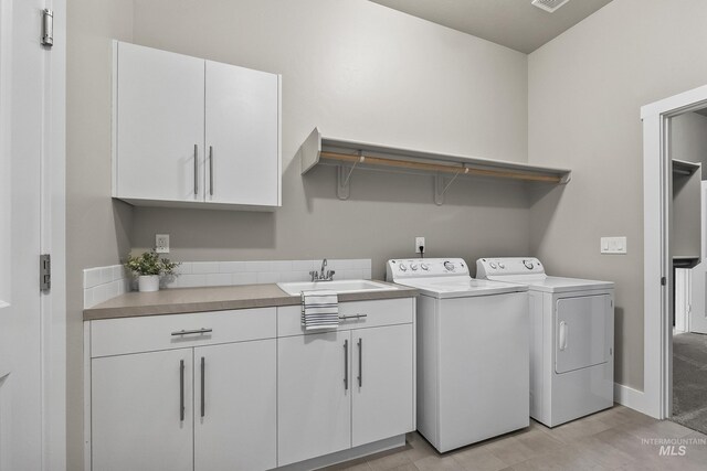 3924 E Forked Deer St, Boise, ID 83716 - laundry room with washer and clothes dryer and cabinet space