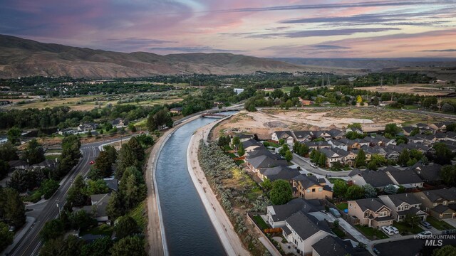 3924 E Forked Deer St, Boise, ID 83716 - aerial view at dusk of a residential view and a water and mountain view