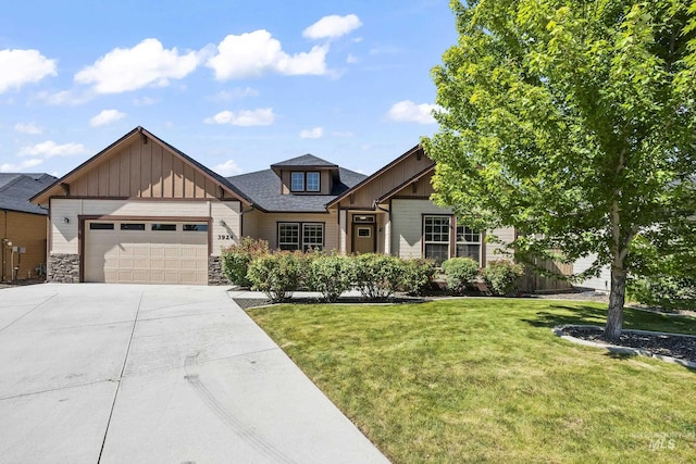 3924 E Forked Deer St, Boise, ID 83716 - craftsman inspired home featuring driveway, board and batten siding, an attached garage, a front lawn, and stone siding