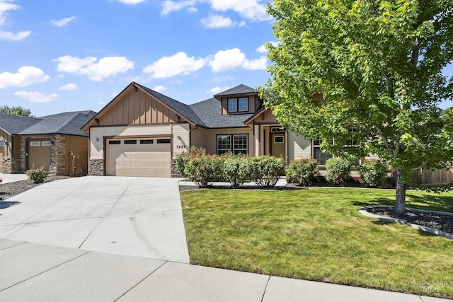 3924 E Forked Deer St, Boise, ID 83716 - view of front of home featuring board and batten siding, a garage, a front yard, concrete driveway, and stone siding