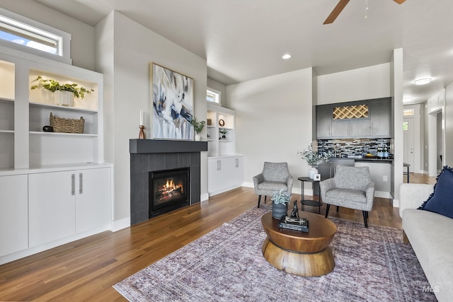 3924 E Forked Deer St, Boise, ID 83716 - living room featuring a tiled fireplace, ceiling fan, wood finished floors, and recessed lighting
