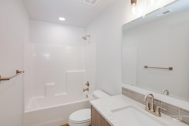 full bathroom featuring visible vents, toilet, backsplash, vanity, and shower / bathtub combination