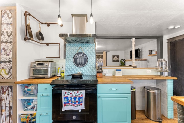 kitchen with pendant lighting, blue cabinets, black / electric stove, and butcher block counters