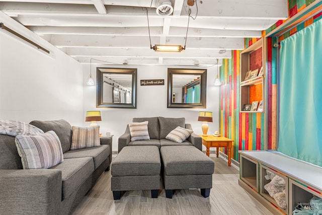 living room featuring light hardwood / wood-style floors and beamed ceiling