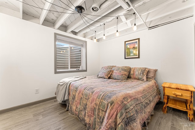 bedroom with hardwood / wood-style floors