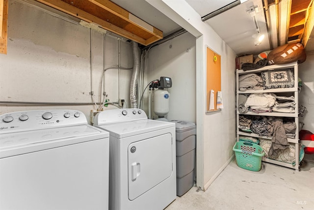 clothes washing area with washing machine and clothes dryer