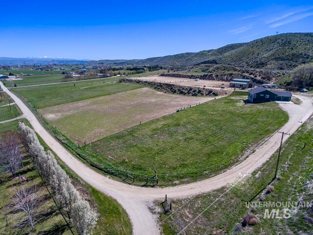 aerial view featuring a rural view and a mountain view