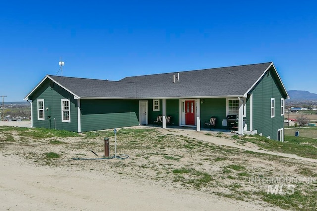 ranch-style home featuring covered porch