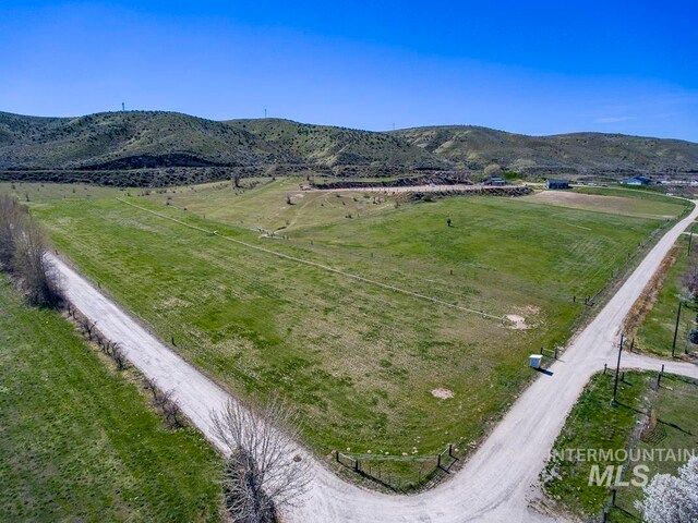 aerial view featuring a rural view and a mountain view