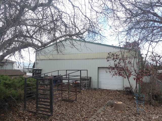 view of side of home with an outdoor structure