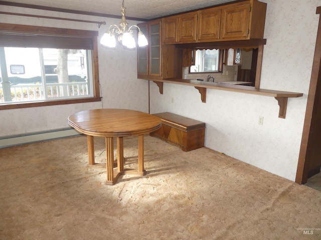 carpeted dining room with a notable chandelier and a baseboard heating unit