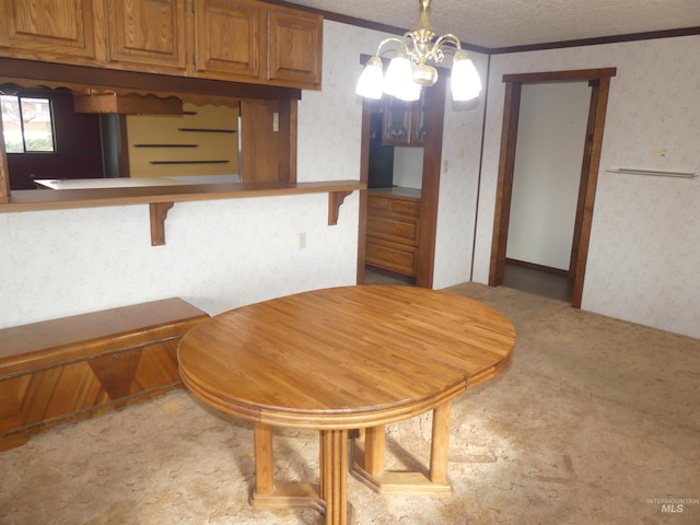 dining space featuring crown molding, a textured ceiling, and a chandelier