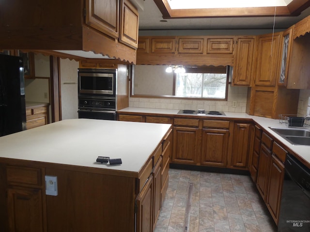 kitchen with sink, backsplash, and black appliances