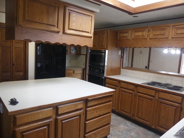 kitchen with built in microwave, stainless steel gas stovetop, and oven