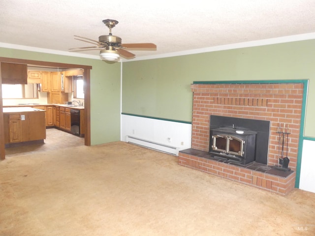 unfurnished living room with light carpet, ornamental molding, a textured ceiling, and baseboard heating