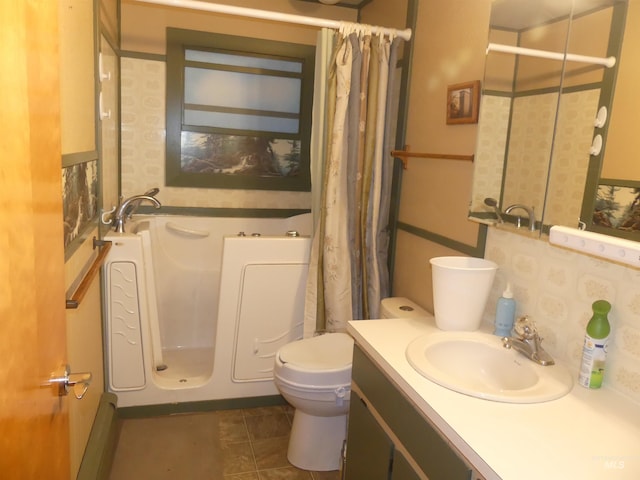 bathroom with a shower with shower curtain, vanity, toilet, and tile patterned flooring