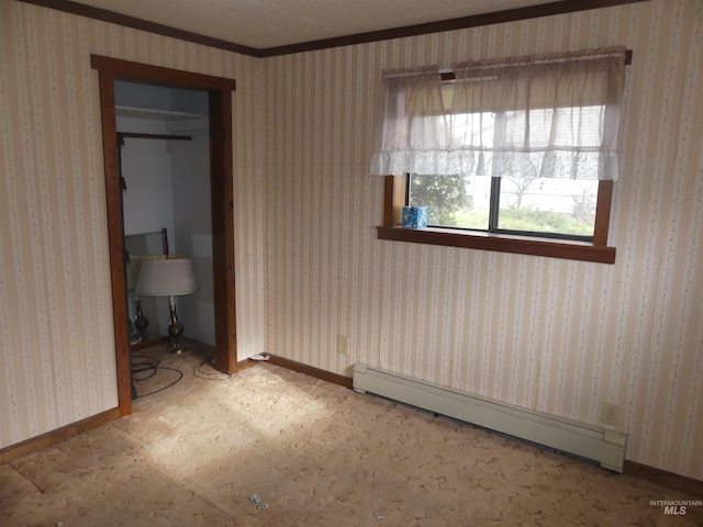 unfurnished bedroom featuring carpet floors and a baseboard heating unit