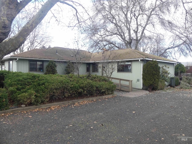 ranch-style house with central AC unit