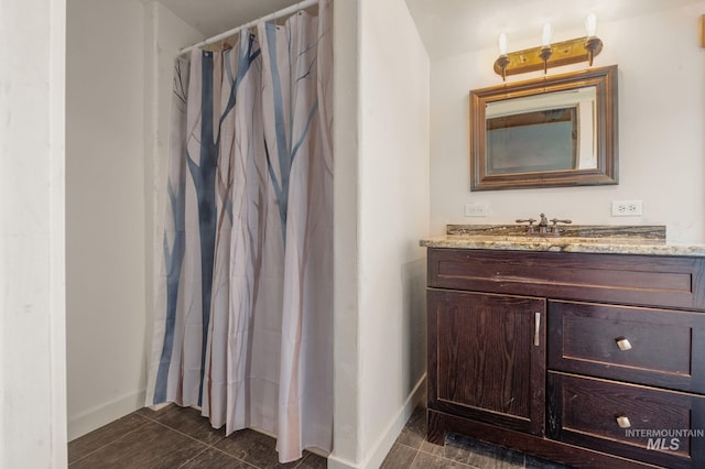 bathroom featuring vanity and walk in shower