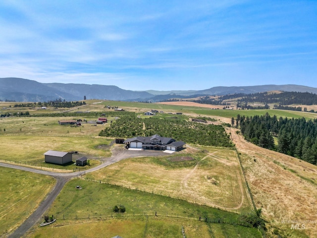 birds eye view of property featuring a mountain view and a rural view