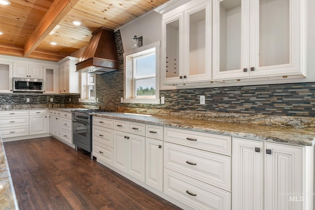 kitchen featuring custom exhaust hood, wooden ceiling, light stone countertops, beamed ceiling, and white cabinetry