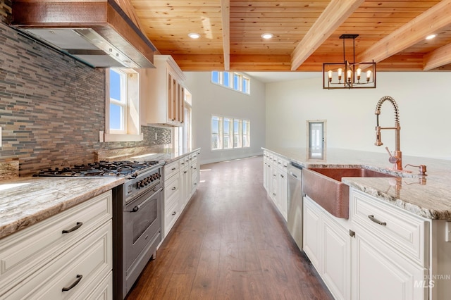 kitchen with custom range hood, beamed ceiling, white cabinetry, stainless steel appliances, and wood ceiling