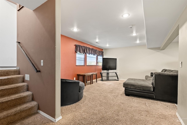 carpeted living room featuring stairs, baseboards, and recessed lighting