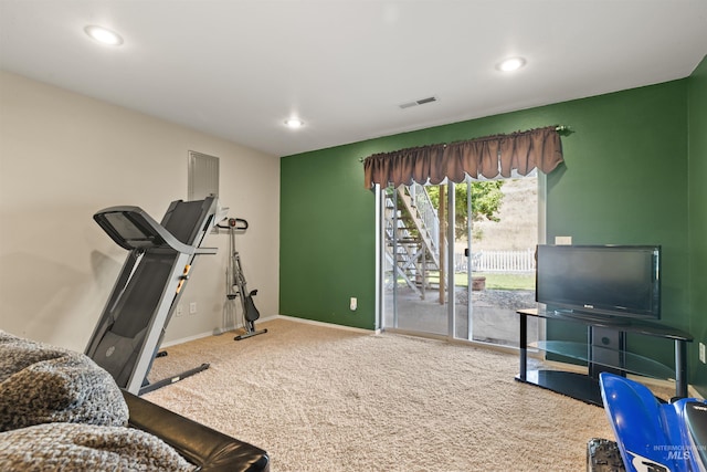 workout area featuring carpet floors, baseboards, visible vents, and recessed lighting