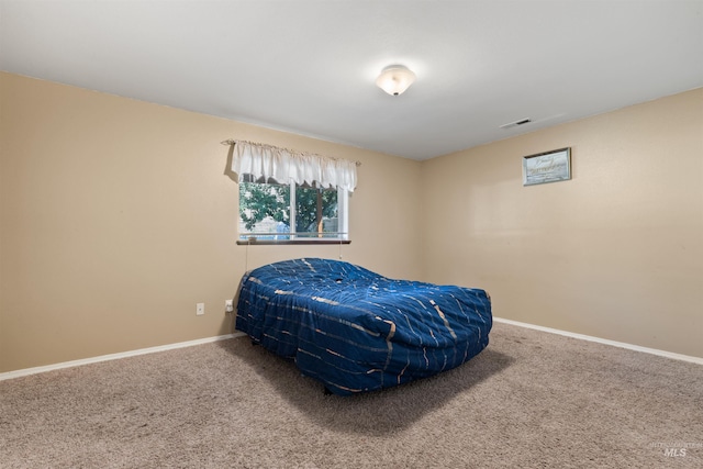 bedroom featuring carpet, visible vents, and baseboards