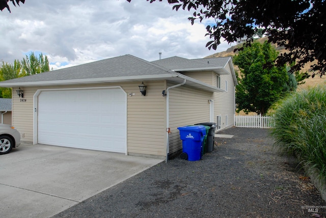 view of side of property featuring a garage