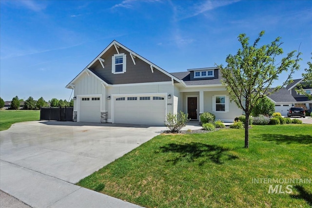 craftsman house with a front lawn and a garage